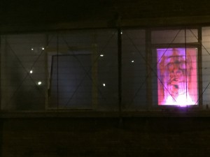 The street window projection showing vibrantly coloured stills by Pauline Alexander (from Many Faces of Discrimination, 2006)